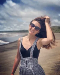 CLAUDIA E.
