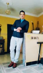 Ali E.